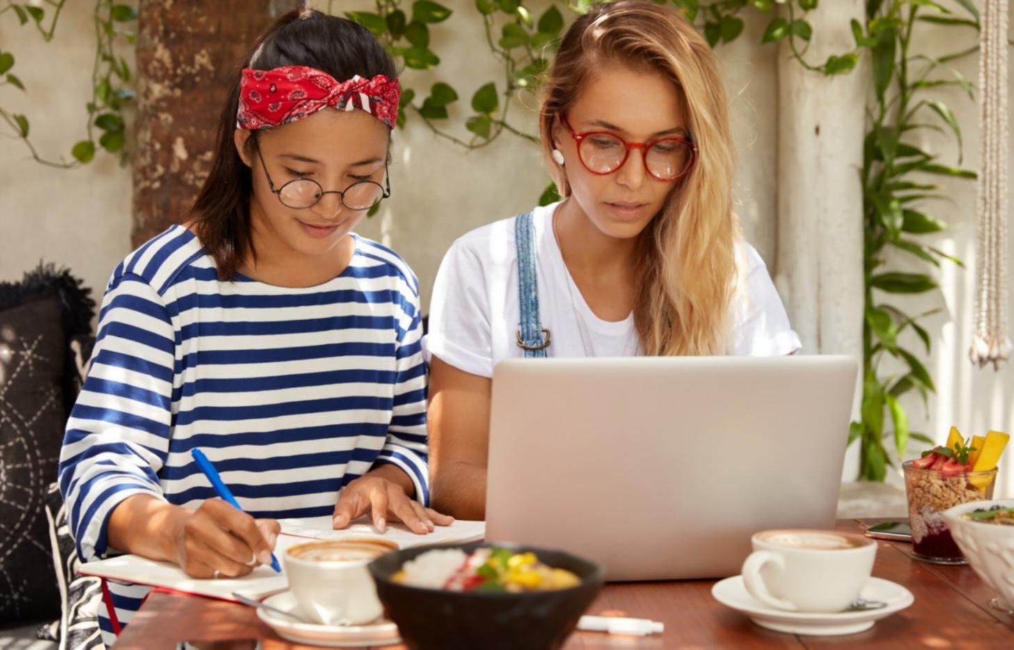 Investment professionals reviewing financial documents during analysis session